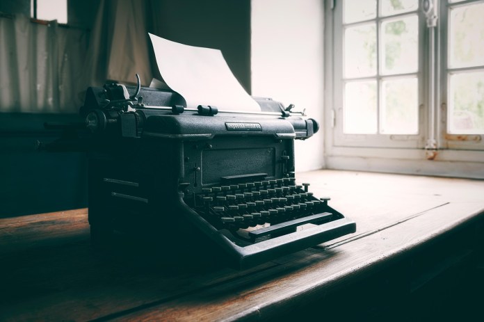 Inspiring image of classic black typewriter - imagine the keys clacking as you write your masterpiece