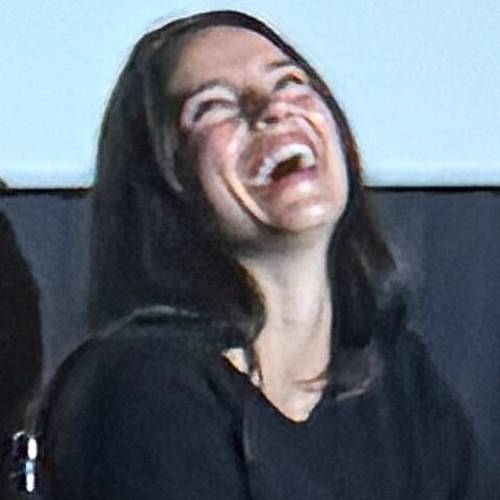 Inde Navarette, star of 2026 hit film Obsession, laughing on stage during a Q and A. She has long dark hair and perfect teeth.